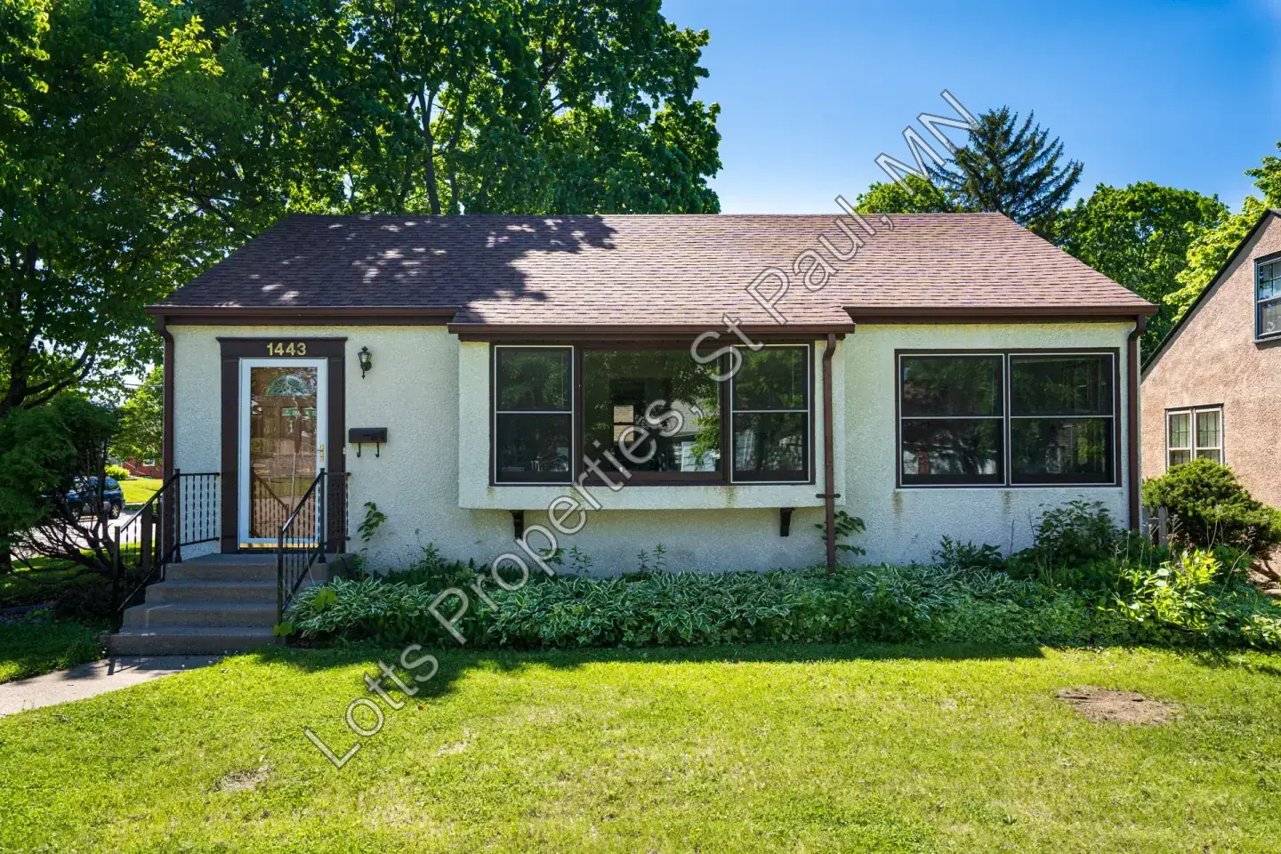 Front exterior of 1443 Saint Albans with the entry path and mature trees