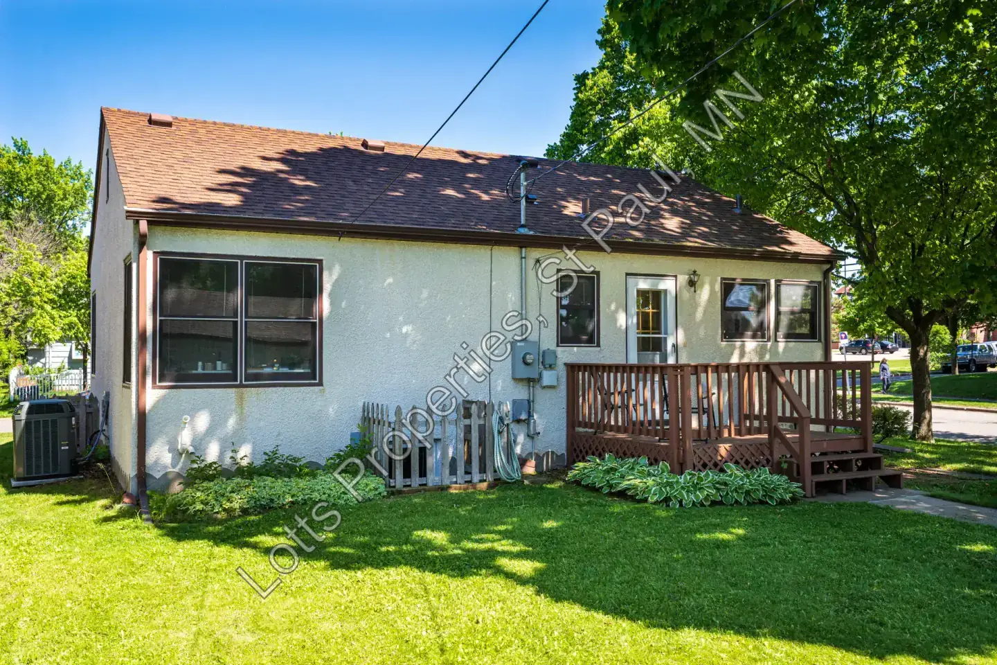 Side and rear view of 1443 Saint Albans showing the deck and backyard