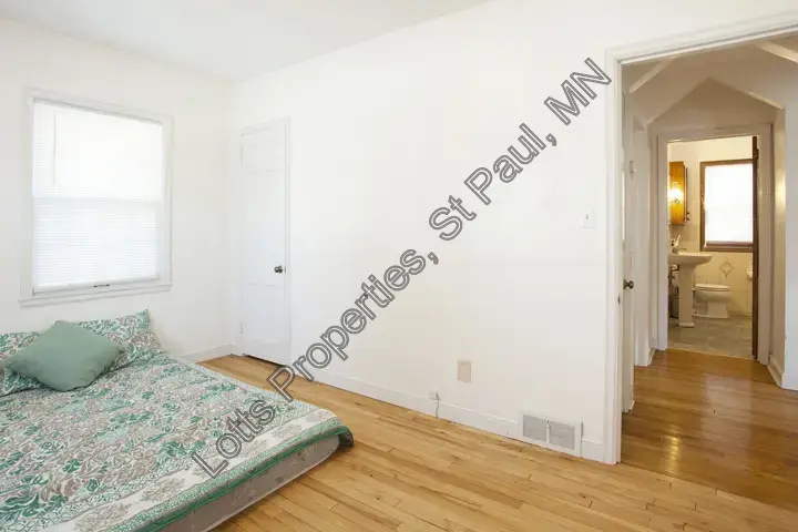Alternate view of the main-floor west bedroom with hall access