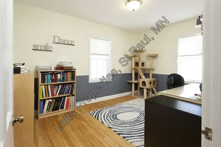 Main-floor east bedroom at 1444 Alameda with flexible layout