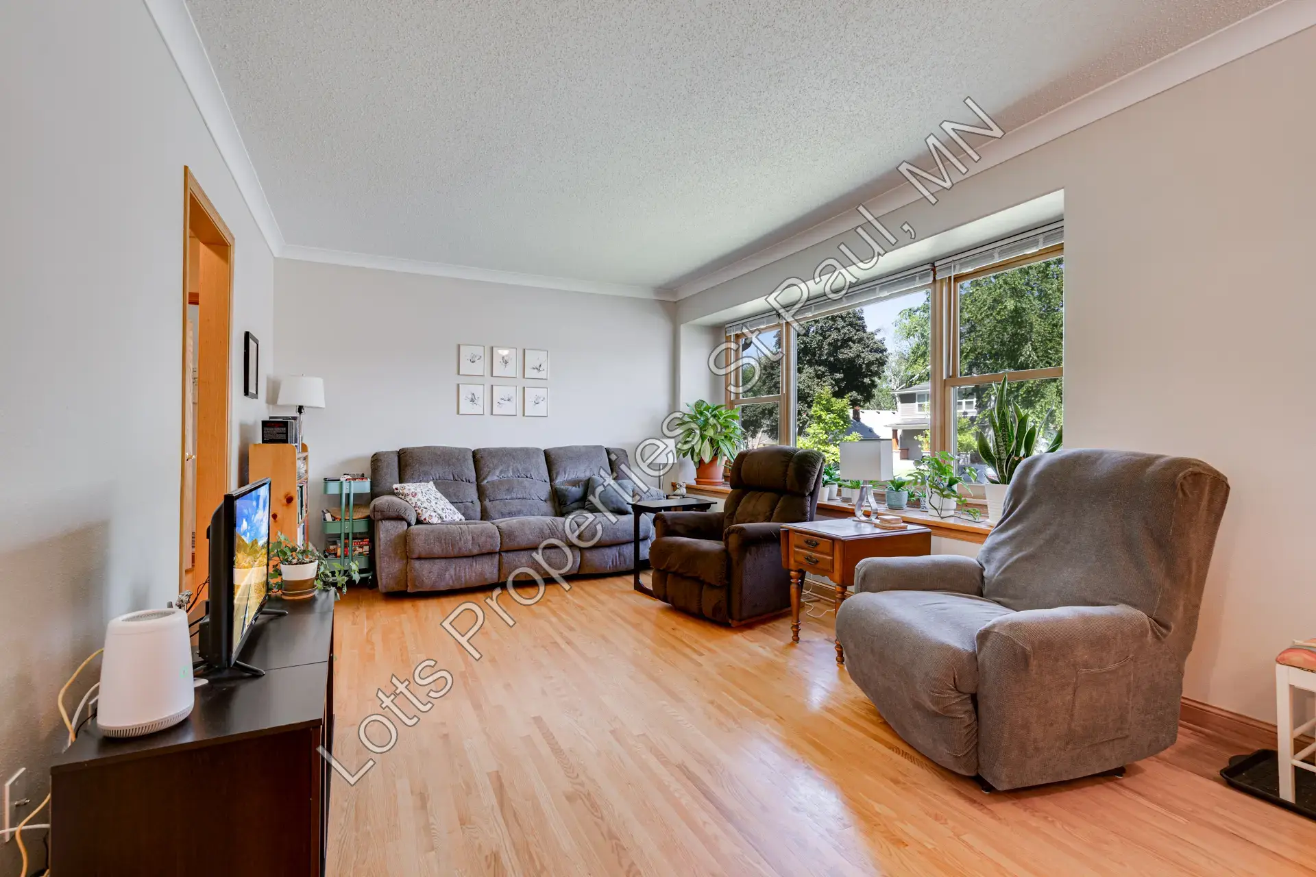 Living room from the opposite corner showing the seating area and built-in window seat
