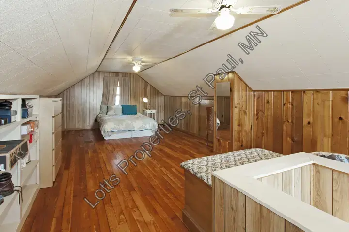 Upstairs bedroom at 1444 Alameda with sloped ceiling and finished walls