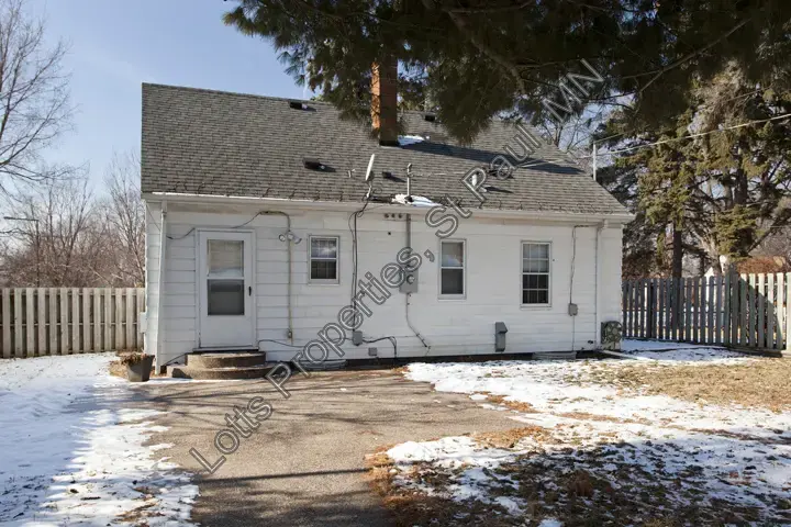 Rear exterior of 1444 Alameda before the recent roof, window, siding, and lighting updates
