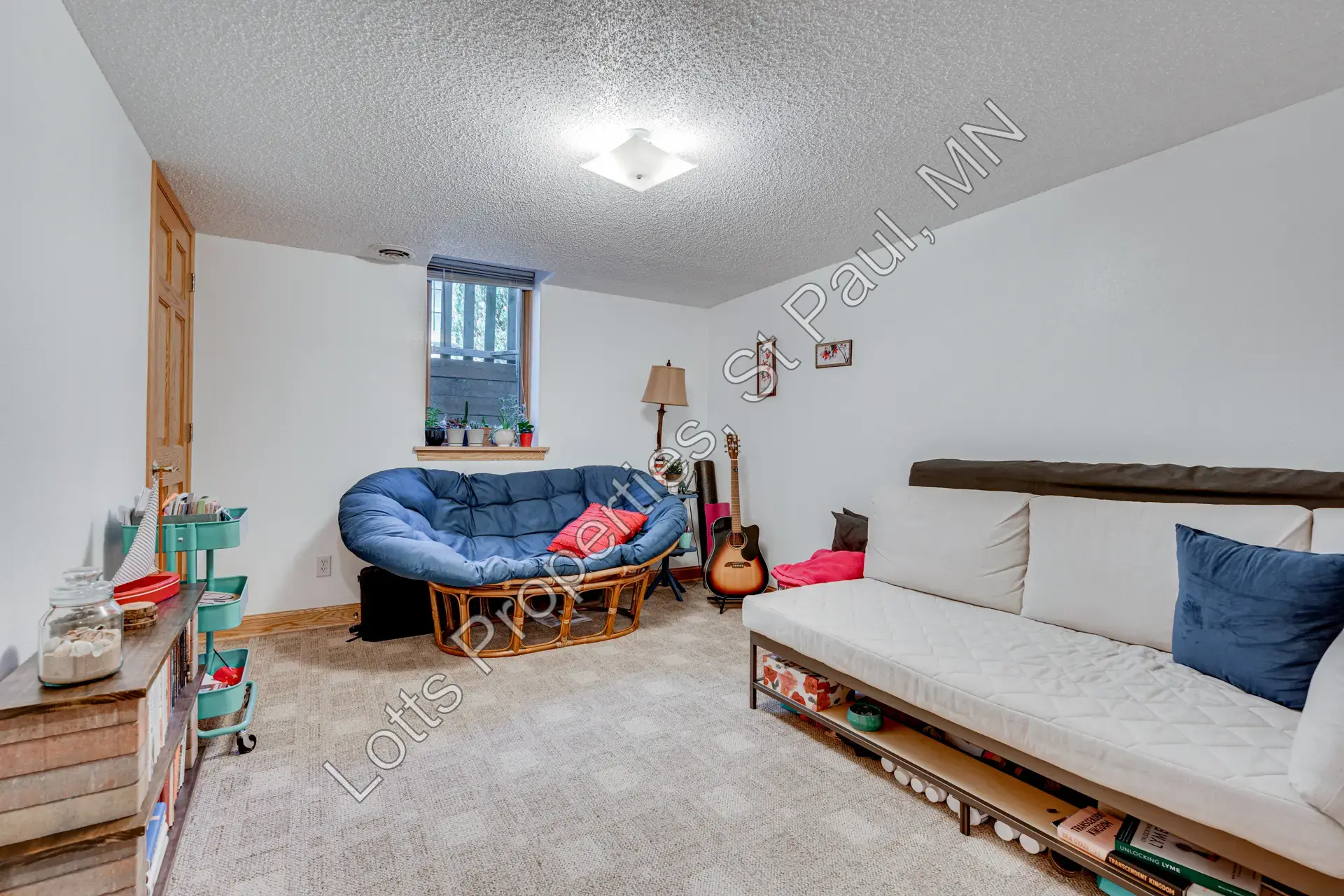 Lower-level east bedroom with open floor space and game table